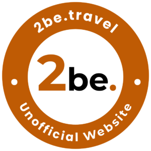 2be.travel unofficial website logo. Orange and white circle with text 2be.travel and Unofficial Website.